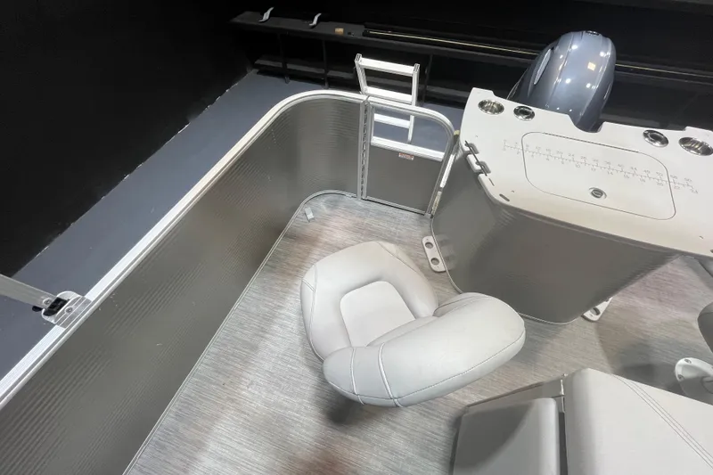 Slide: The Image of 2023 Bennington 22 FS boat interior with seating and control panel. - 11