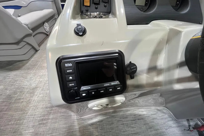 Slide: The Image of 2023 Bennington 22 FS boat dashboard with audio system and controls. - 15