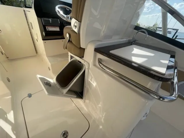 Slide: The Image of Interior of a 2019 Scout 255 Dorado boat with storage compartment. - 11