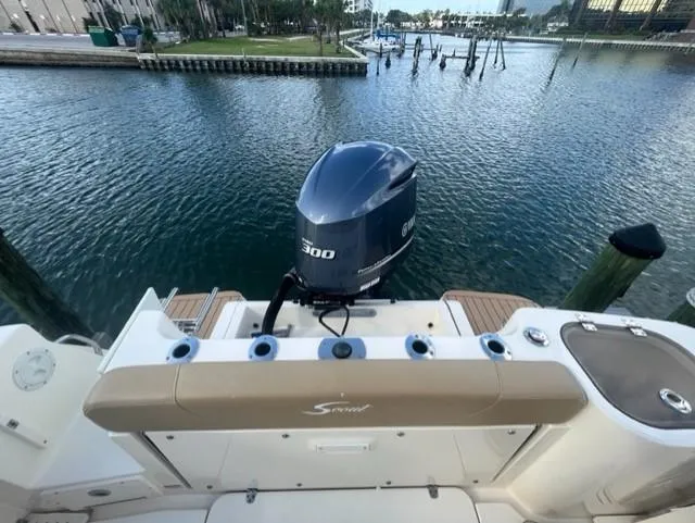 Slide: The Image of Rear view of a 2019 Scout 255 Dorado boat with outboard motor. - 5