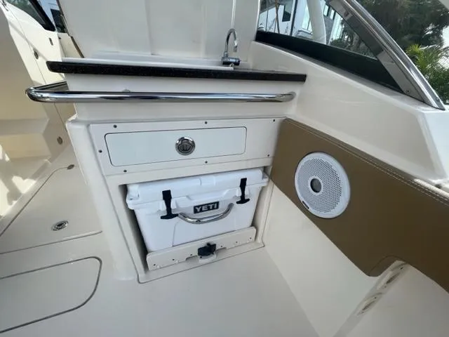 Slide: The Image of Interior of a 2019 Scout 255 Dorado with Yeti cooler. - 7