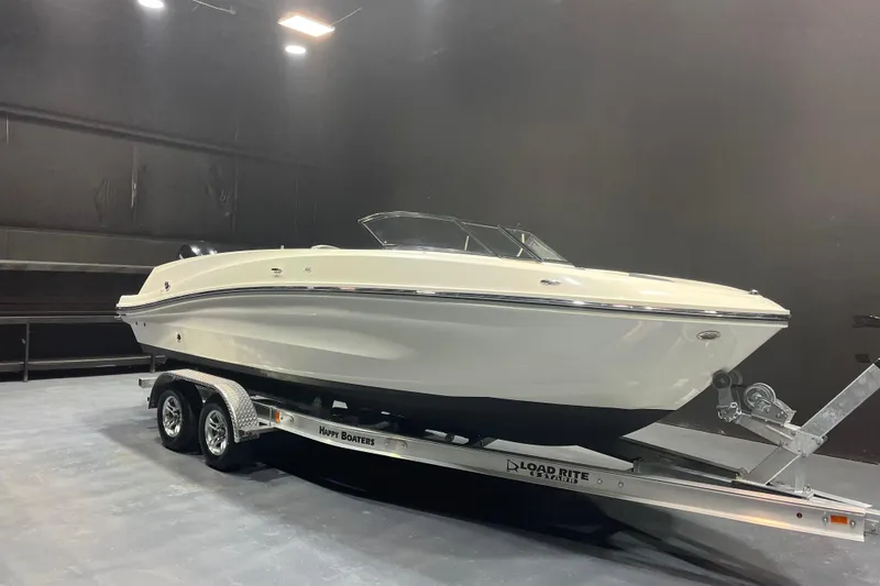 The Image of 2022 Bayliner VR6 Bowrider OB on trailer in indoor showroom. - 1