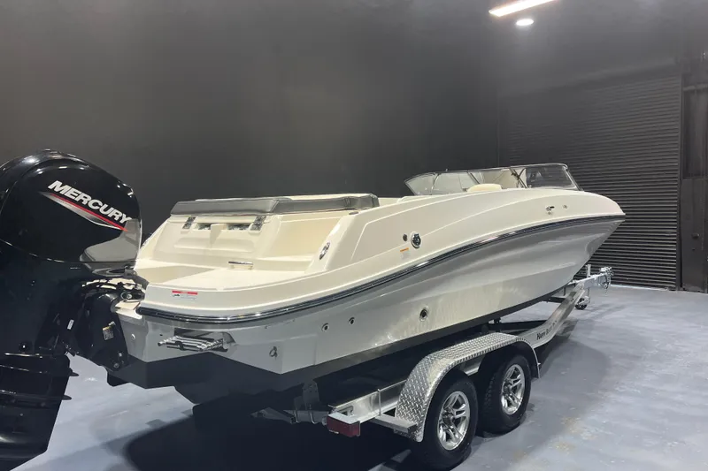 Slide: The Image of 2022 Bayliner VR6 Bowrider OB on trailer with Mercury outboard motor. - 4