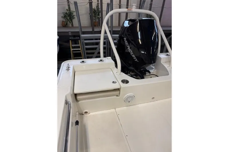 Slide: The Image of 2024 Boston Whaler 210 Montauk boat with Mercury engine, interior view. - 10