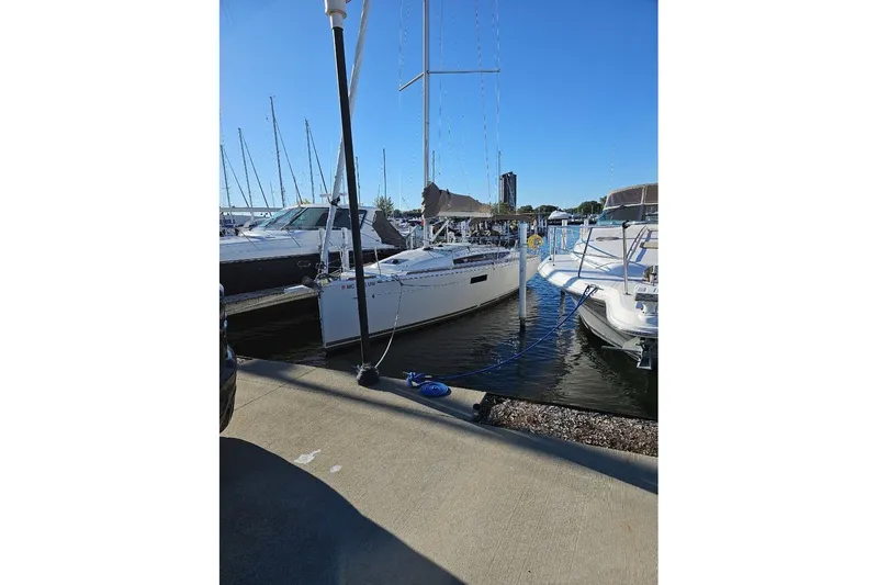 The Image of Jeanneau Sun Odyssey 349 sailboat docked in marina, 2023 model. - 0