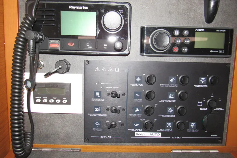 Slide: The Image of Control panel of a 2023 Jeanneau Sun Odyssey 349 sailboat with navigation and audio systems. - 11