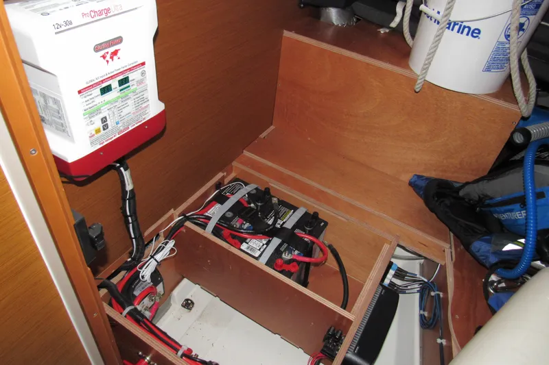 Slide: The Image of Electrical system of 2023 Jeanneau Sun Odyssey 349 sailboat, featuring battery and charger setup. - 16