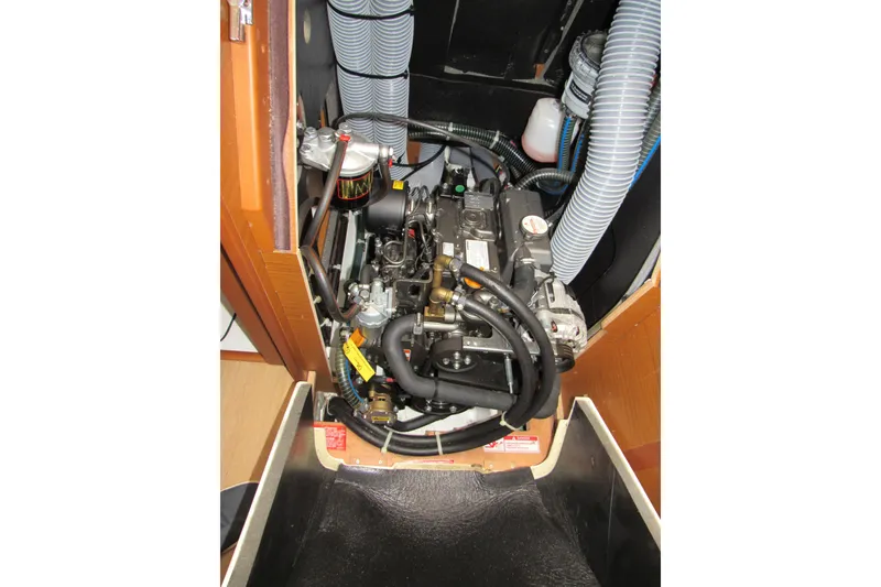 Slide: The Image of Engine compartment of 2023 Jeanneau Sun Odyssey 349 sailboat, showcasing detailed mechanical components. - 17