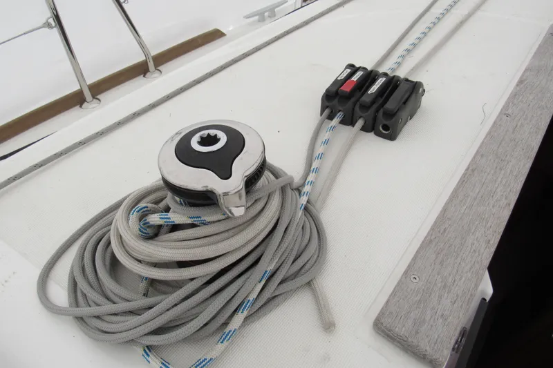 Slide: The Image of Winch and ropes on 2023 Jeanneau Sun Odyssey 349 sailboat deck. - 19