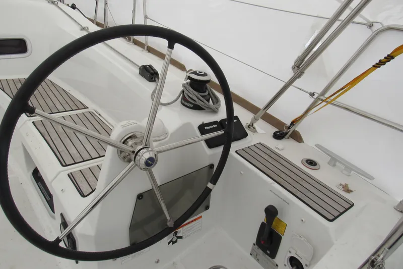 Slide: The Image of Steering wheel and controls of 2023 Jeanneau Sun Odyssey 349 sailboat cockpit. - 23