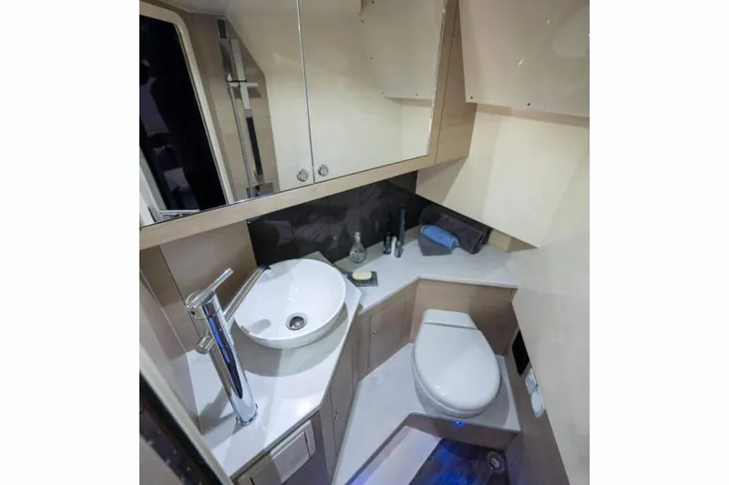 Slide: The Image of Manufacturer Provided Image: 2023 Scout 350 LXZ boat bathroom with modern fixtures and compact design. - 15