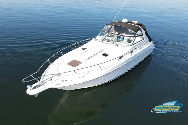 Slide: The Image of 1997 Sea Ray 330 Sundancer cruising on calm water, aerial view. - 17