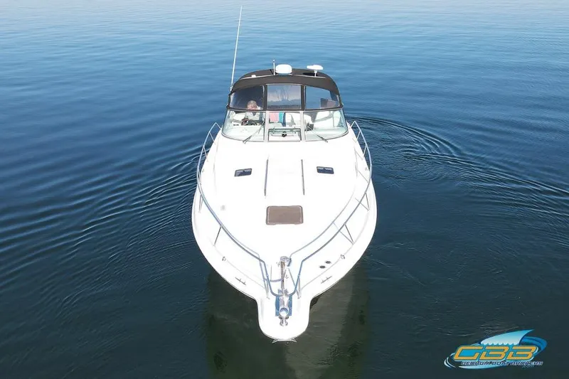Slide: The Image of 1997 Sea Ray 330 Sundancer cruising on calm waters, aerial view. - 18