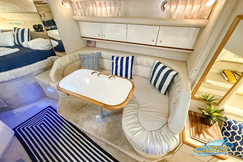Slide: The Image of Luxurious interior of 1997 Sea Ray 330 Sundancer with cozy seating and elegant decor. - 32