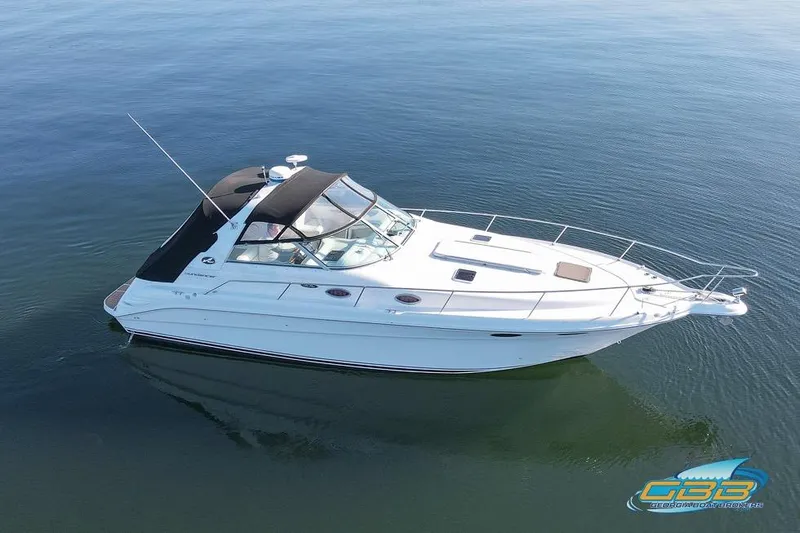 Slide: The Image of 1997 Sea Ray 330 Sundancer boat on calm water, aerial view. - 4