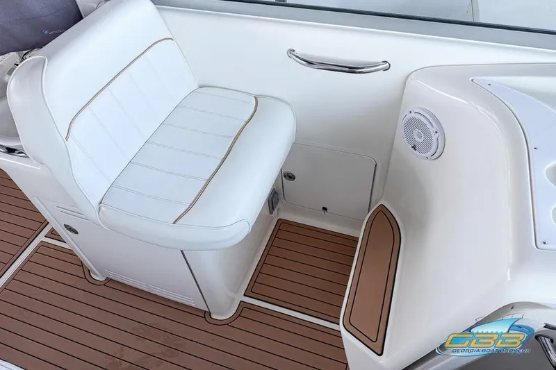 Slide: The Image of White seating on 1997 Sea Ray 330 Sundancer boat with teak flooring and speaker. - 41