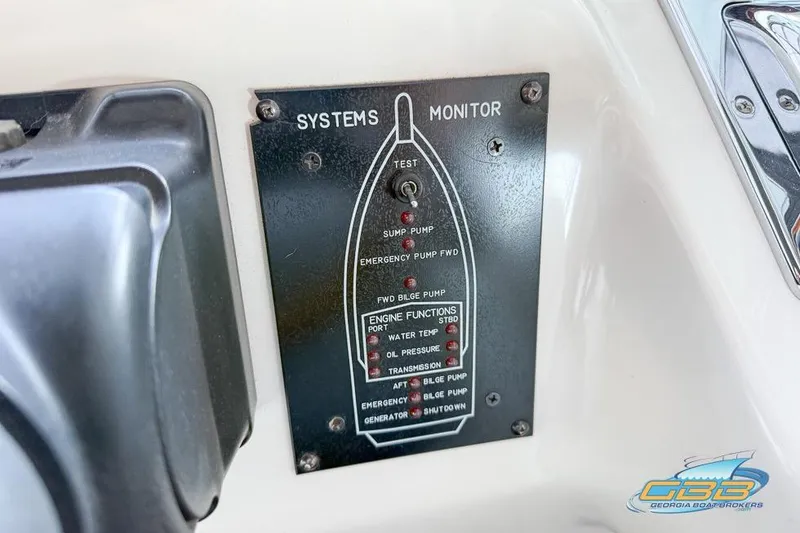 Slide: The Image of 1997 Sea Ray 330 Sundancer systems monitor panel with various function indicators. - 45