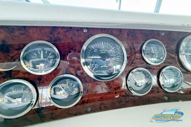 Slide: The Image of Dashboard of a 1997 Sea Ray 330 Sundancer with various gauges and controls. - 47