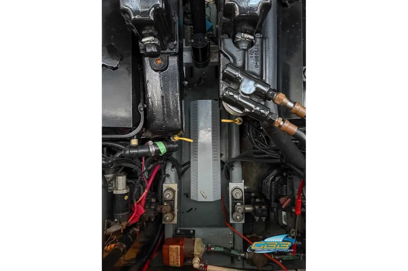 Slide: The Image of Engine compartment of a 1997 Sea Ray 330 Sundancer boat, showing mechanical components. - 49