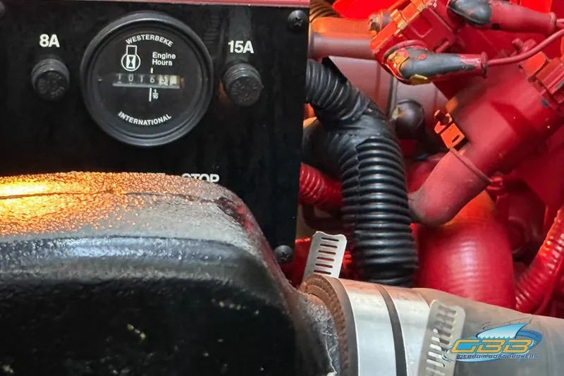 Slide: The Image of Engine compartment of 1997 Sea Ray 330 Sundancer with Westerbeke engine hour meter. - 51