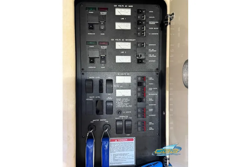 Slide: The Image of Electrical control panel on a 1997 Sea Ray 330 Sundancer boat. - 52