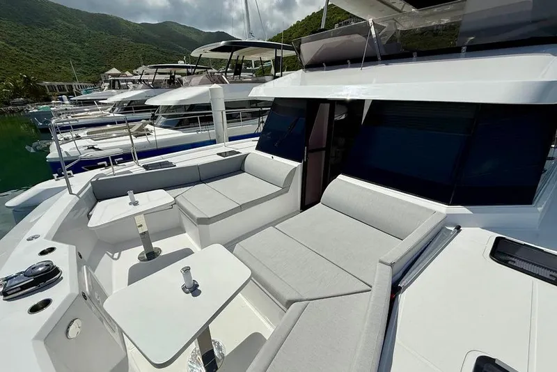 Slide: The Image of Luxurious 2026 Aventura 56 Motor Yacht with spacious outdoor seating and sleek design. - 10