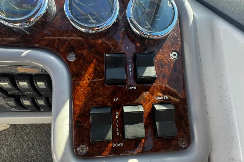 Slide: The Image of Dashboard controls of a 2004 Formula 280 Sun Sport boat with switches and gauges. - 13