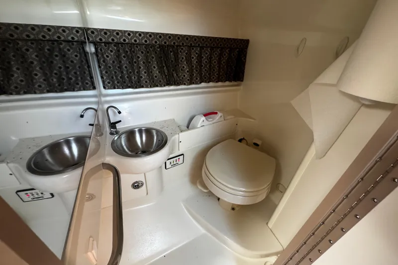 Slide: The Image of 2004 Formula 280 Sun Sport boat bathroom with sink and toilet. - 19