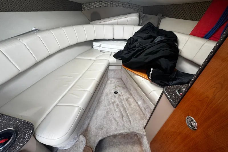 Slide: The Image of Interior of a 2004 Formula 280 Sun Sport boat with white leather seating. - 21