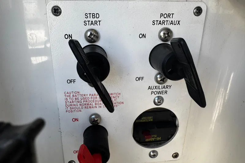 Slide: The Image of Control panel of a 2004 Formula 280 Sun Sport boat with start switches and auxiliary power. - 24