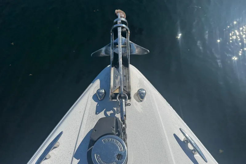 Slide: The Image of Bow of 2004 Formula 280 Sun Sport boat with anchor over water. - 27