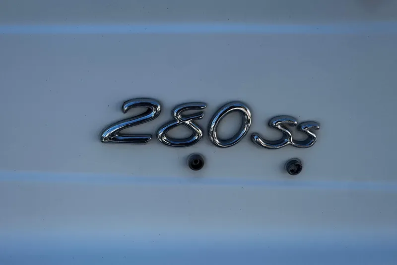Slide: The Image of Chrome "280 SS" emblem on a 2004 Formula 280 Sun Sport boat. - 28