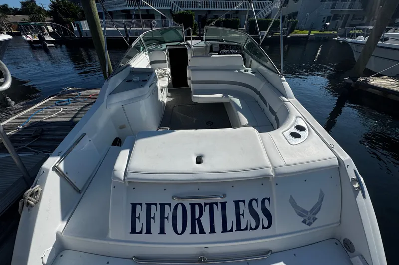 Slide: The Image of 2004 Formula 280 Sun Sport boat named "Effortless" docked at a marina. - 3