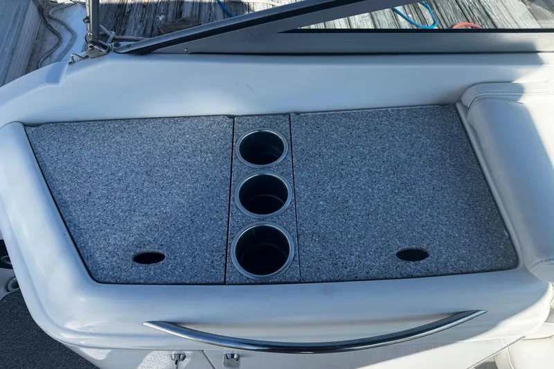 Slide: The Image of 2004 Formula 280 Sun Sport boat interior with cup holders and storage compartments. - 6