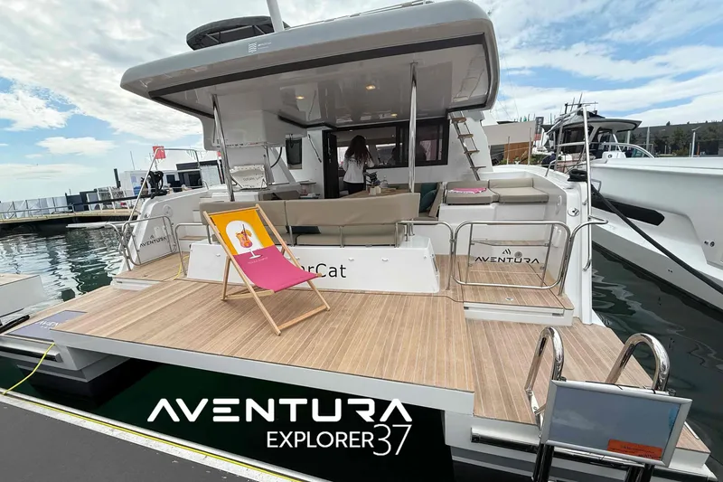 Slide: The Image of Aventura 37 Explorer Trawler 2026 docked, featuring spacious deck and modern design. - 15