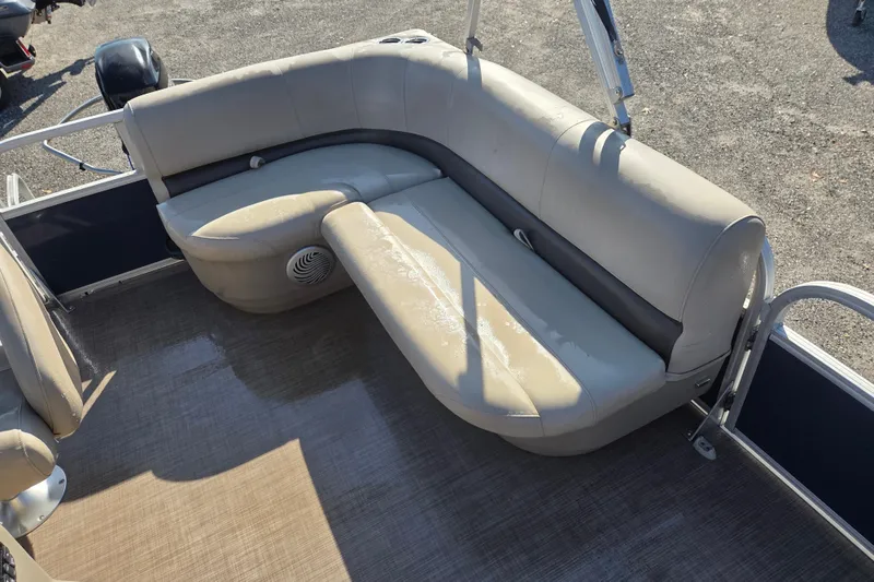 Slide: The Image of 2021 Sun Tracker Bass Buggy 16 XL pontoon boat with beige seating and spacious deck. - 14