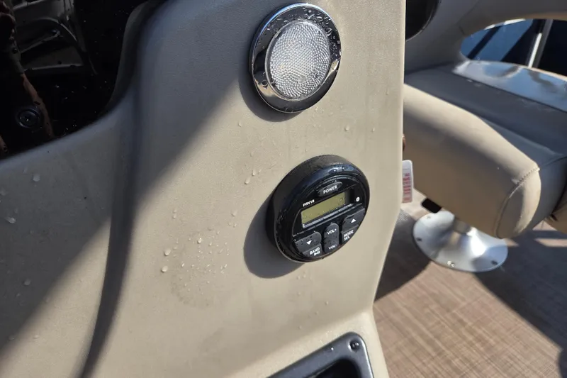 Slide: The Image of Control panel of 2021 Sun Tracker Bass Buggy 16 XL boat with speaker and radio. - 8