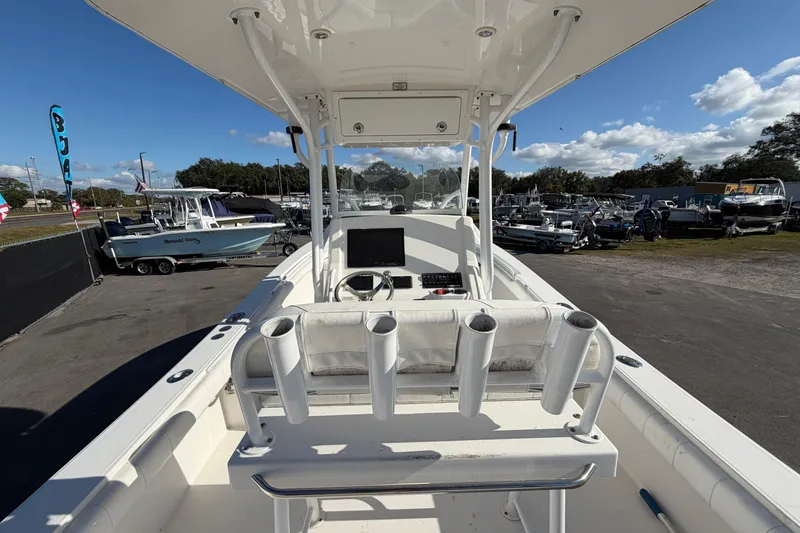 Slide: The Image of 2013 Regulator 24 Forward Seating boat on trailer, sunny day, outdoor display. - 10