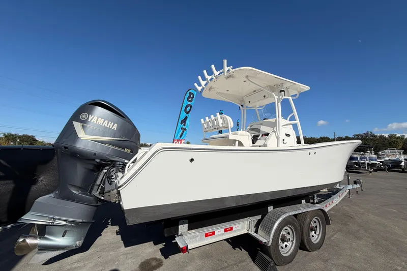 Slide: The Image of 2013 Regulator 24 Forward Seating boat on trailer with Yamaha engine. - 2