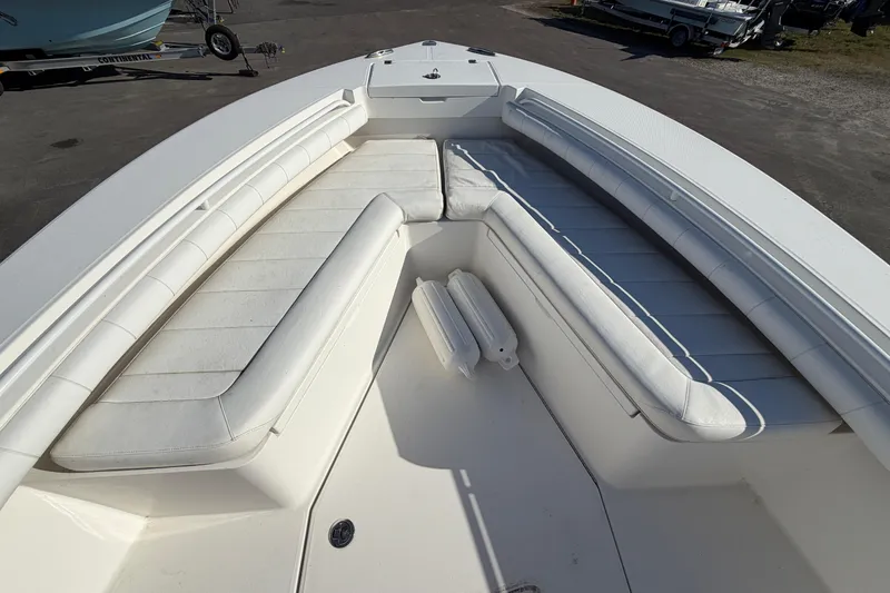 Slide: The Image of 2013 Regulator 24 Forward Seating boat interior with steering wheel and navigation display. - 20