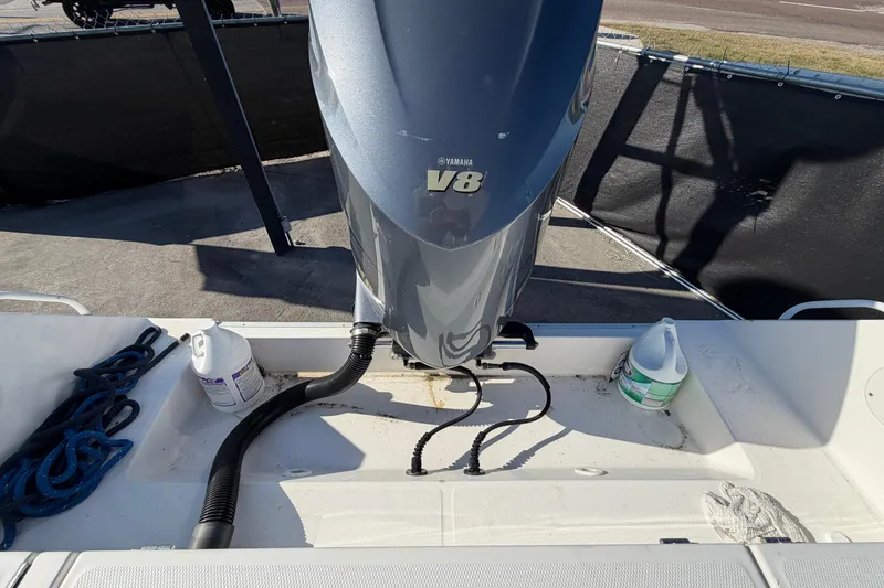 Slide: The Image of 2013 Regulator 24 Forward Seating boat console with storage compartment and latches. - 27