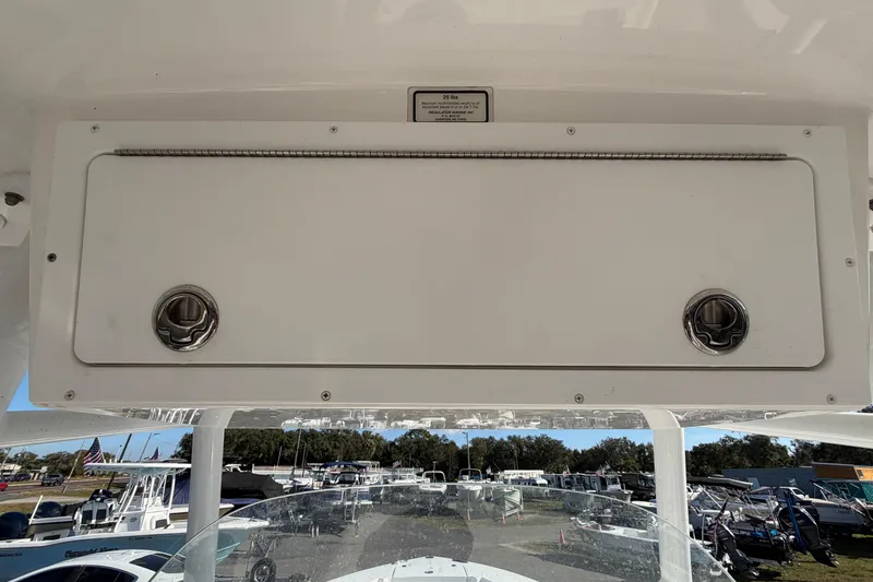 Slide: The Image of 2013 Regulator 24 Forward Seating boat console with radio and remote storage. - 28