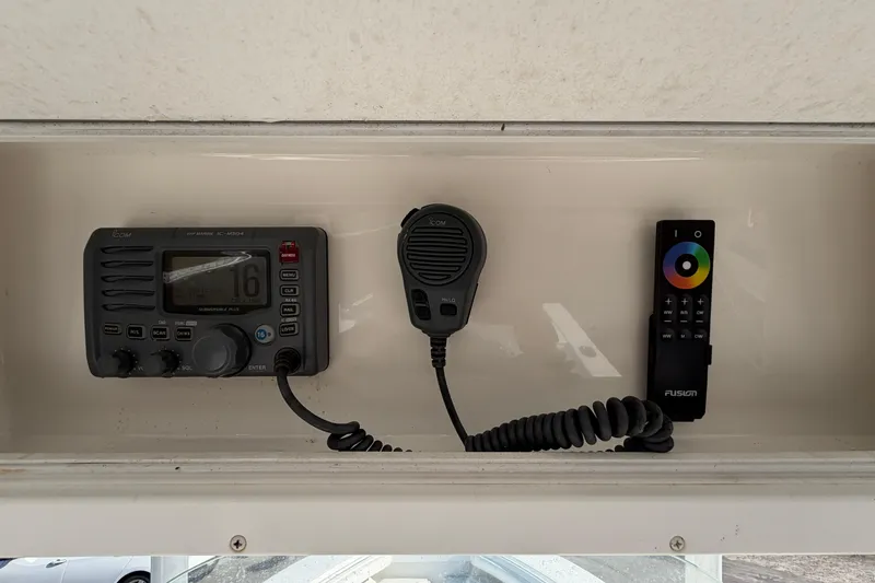 Slide: The Image of 2013 Regulator 24 Forward Seating boat dashboard with steering wheel and navigation display. - 30