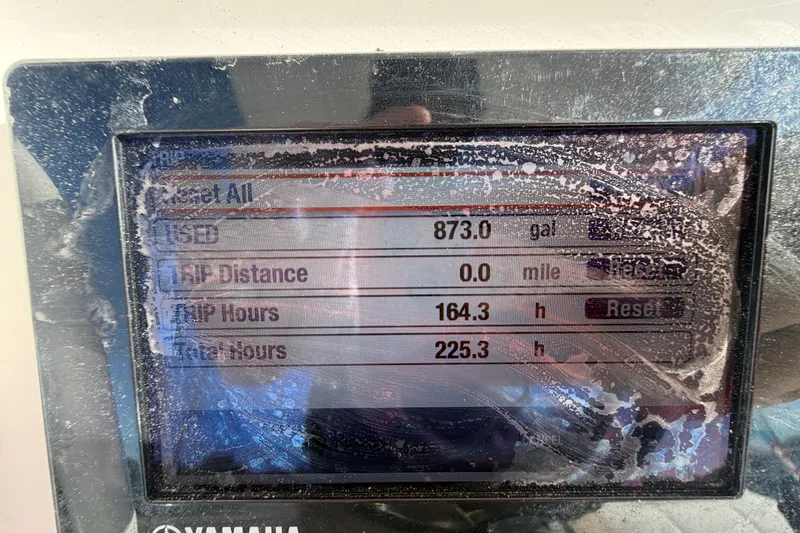 Slide: The Image of Fusion stereo system displaying "Unwritten" by Natasha Bedingfield on a Regulator 24 Forward Seating boat. - 35