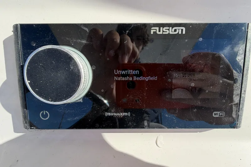 Slide: The Image of Control panel of a 2013 Regulator 24 Forward Seating boat with labeled switches. - 36