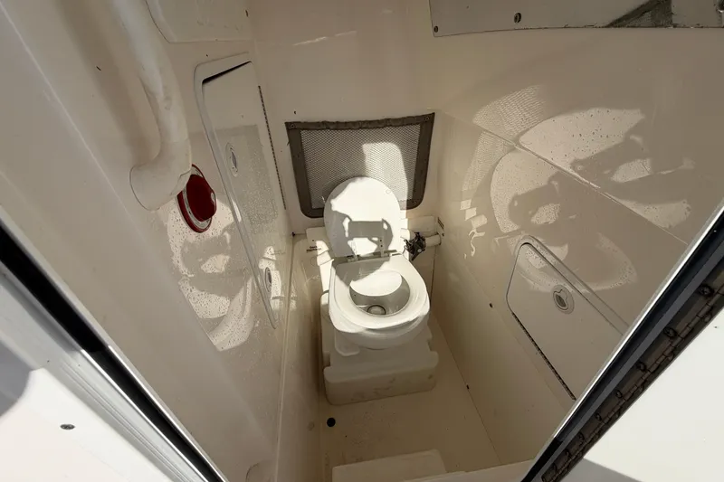 Slide: The Image of Battery selector switch on 2013 Regulator 24 Forward Seating boat, with water droplets. - 49