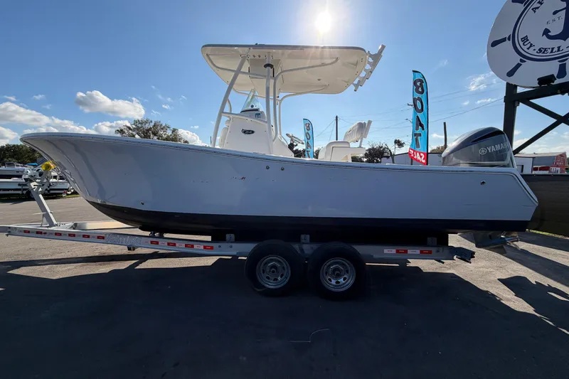 Slide: The Image of 2013 Regulator 24 Forward Seating boat with V8 350 four-stroke engine at sale event. - 5