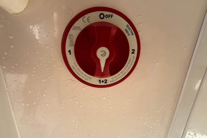 Slide: The Image of 2013 Regulator 24 Forward Seating boat interior compartment with latch and mesh pocket. - 50