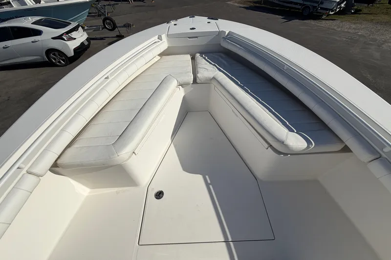 Slide: The Image of 2013 Regulator 24 Forward Seating boat interior with storage compartment. - 54