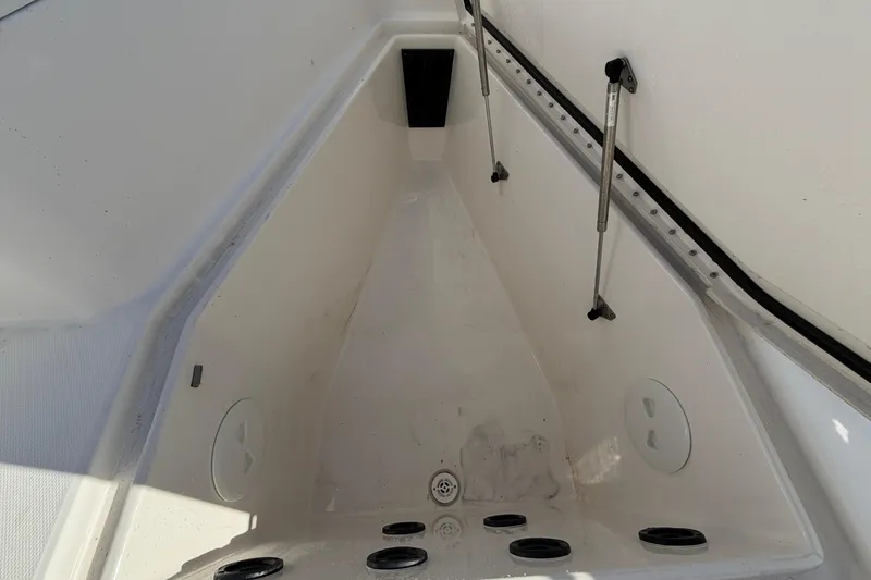 Slide: The Image of 2013 Regulator 24 Forward Seating boat interior with shadow on deck. - 57